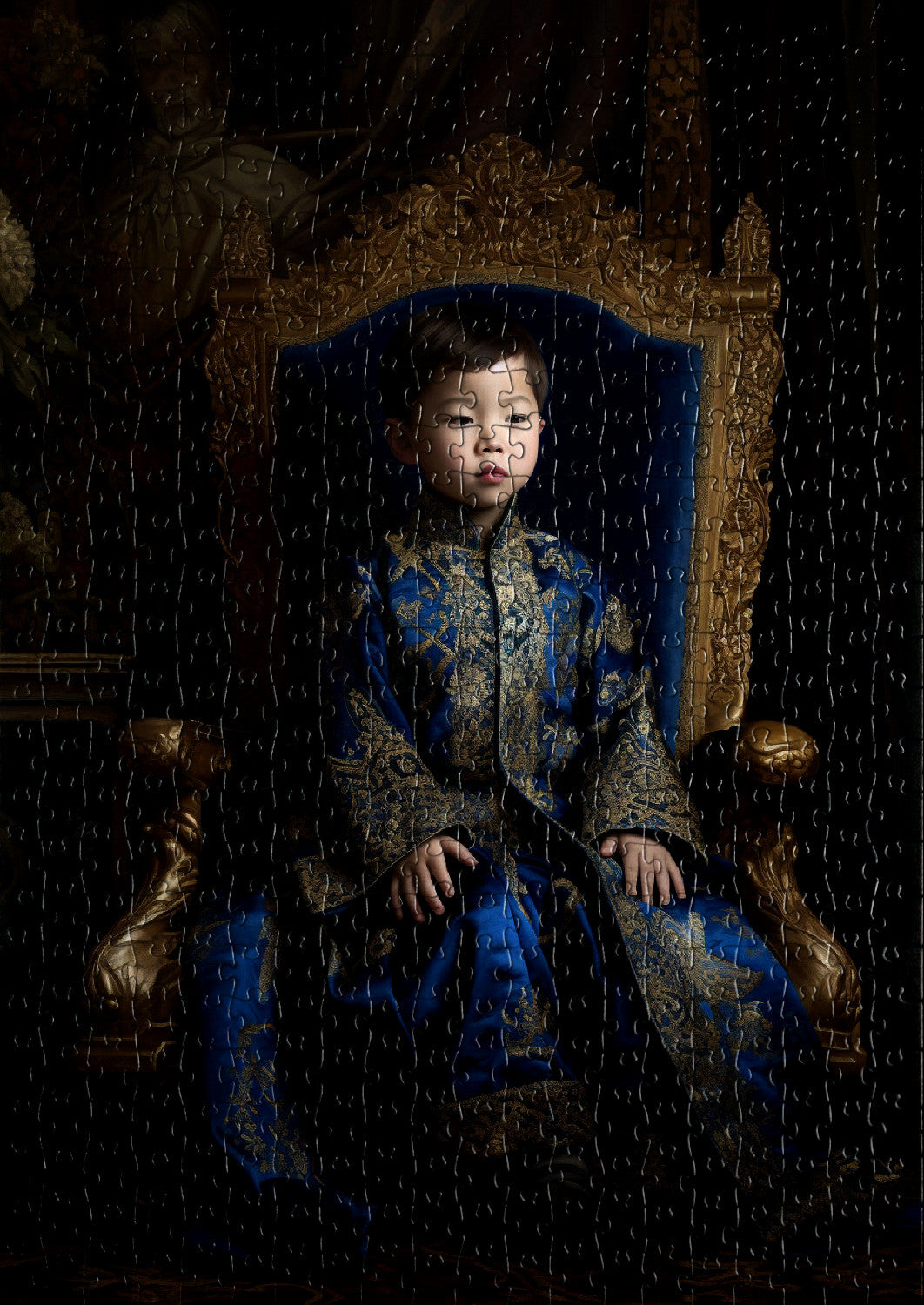 Young emperor boy in a royal setting