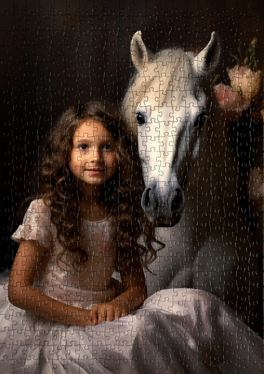Little girl sitting with a white unicorn